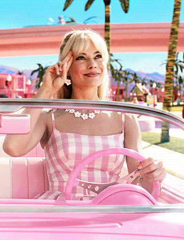 Barbie in a pink convertible for a girls weekend or bachelorette vibe